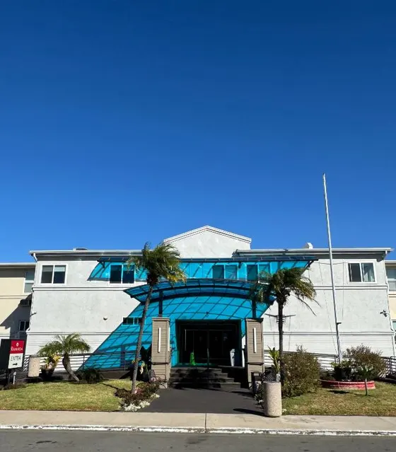 Building with a blue covering on the front of it