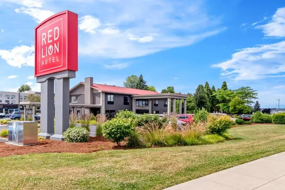 Red lion hotel sign in front of a building