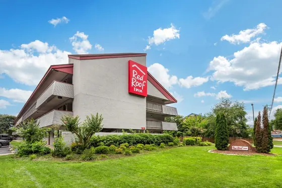 Building with a red sign on the side of it