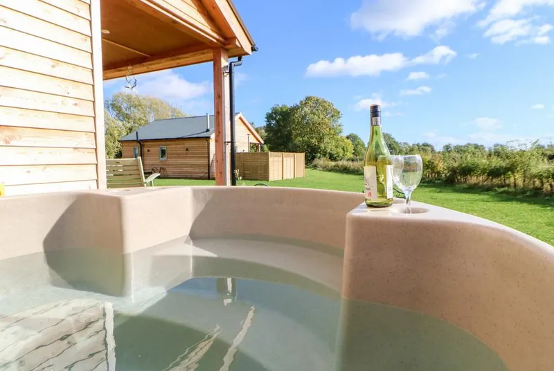Rising Sun inside hot tub with wine and North York Moors countryside