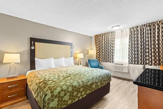 Hotel room with a bed and a window