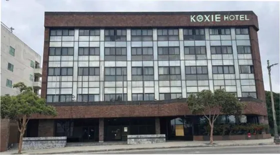 Large building with a sign on top of it