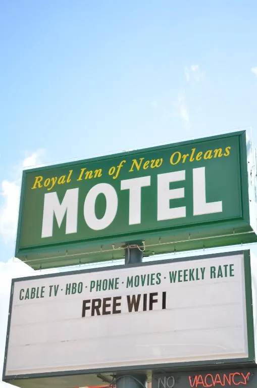 Green and white Royal Inn of New Orleans motel sign