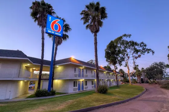 Building with a no parking sign in front of it