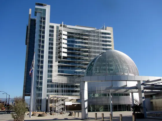 San Jose City Hall tower and glass-domed rotunda beneath a blue sky