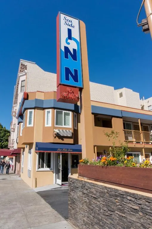 Large building with a sign for a hotel