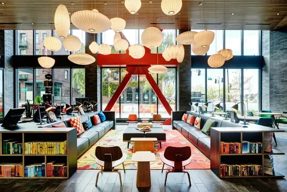 Library with couches and chairs and tables and windows