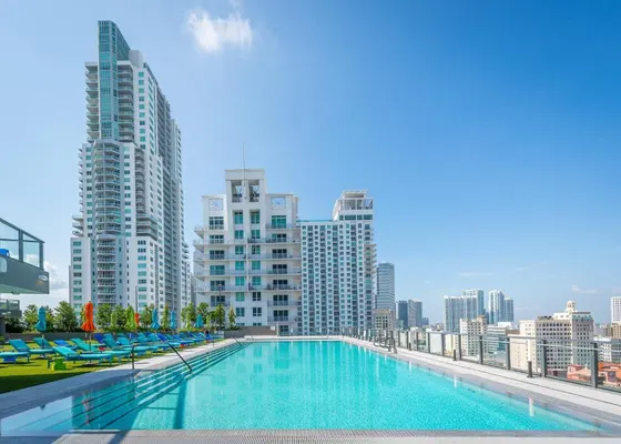 Swimming pool on the roof of a building with tall buildings