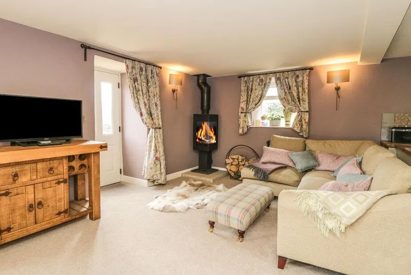Shawclough Barn lounge with wood burner and sofas