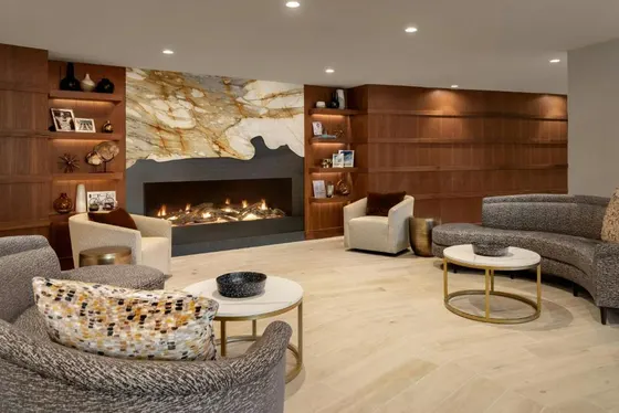 Living room with a fireplace and chairs