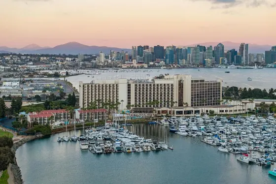 Aerial view of a marina with boats in the water
