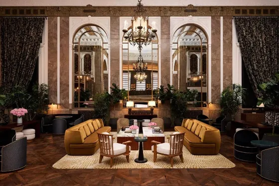 Lobby with a table and chairs and a chandelier