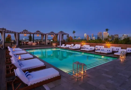 Swimming pool with lounge chairs and a hotel