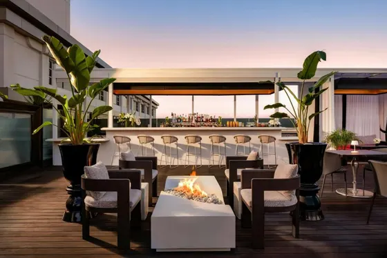 Patio with a fire pit on a roof