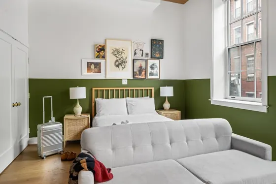Bedroom with a bed and a couch