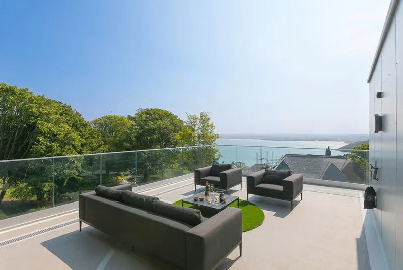 Sparrows Nest roof terrace seating with sea glimpse
