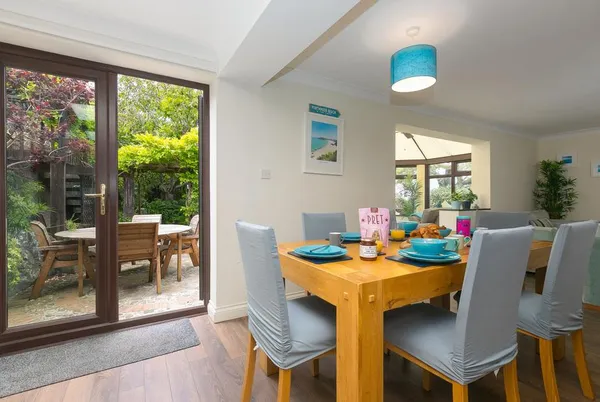 Spernenwyn dining area opening to the patio garden