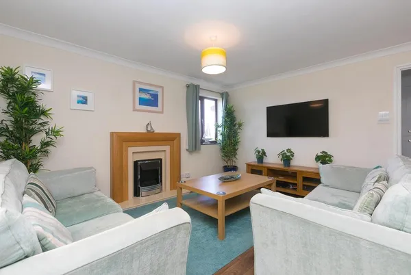 Spernenwyn lounge with fireplace and soft coastal palette
