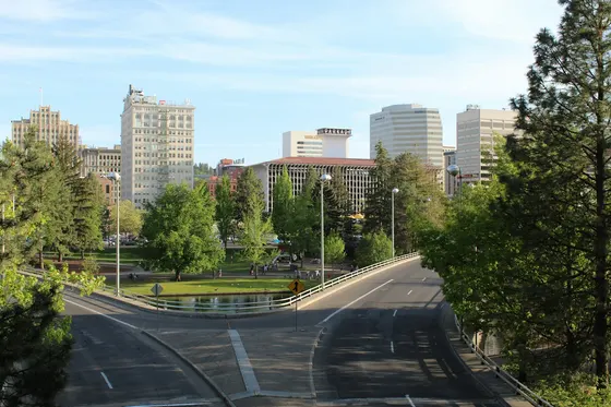 Downtown Spokane seen across Riverfront Park on a sunny day