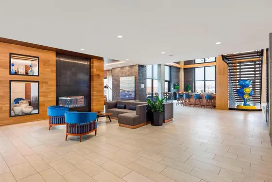 Lobby with a couch and tables and chairs