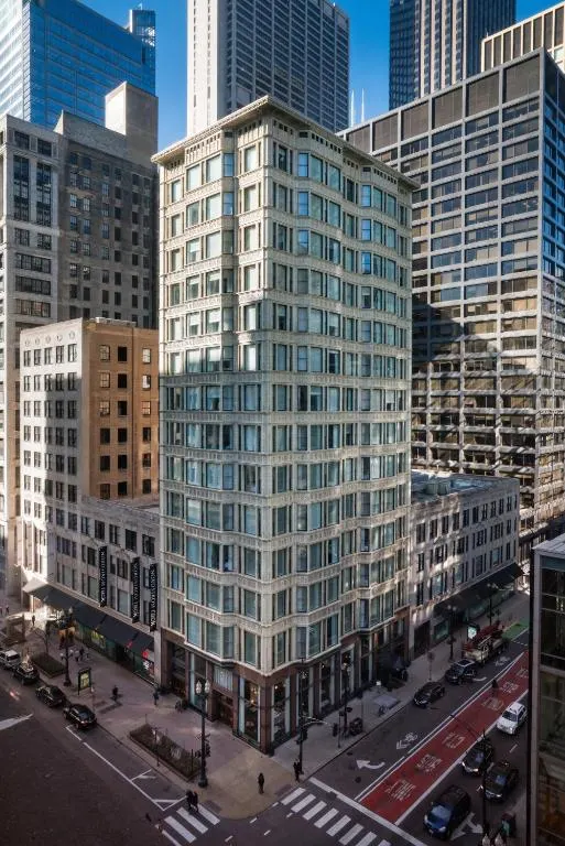 Aerial view of a tall building in a city