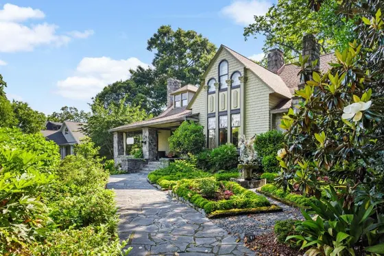 House with a stone walkway in front of it