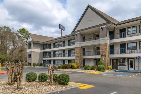 Exterior view of a hotel with a parking lot