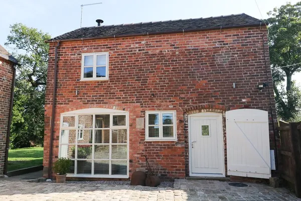 Orchard Barn red brick barn conversion with arched window and stable door