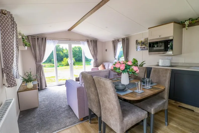 Swan Lodge bright open-plan lounge with outdoor outlook