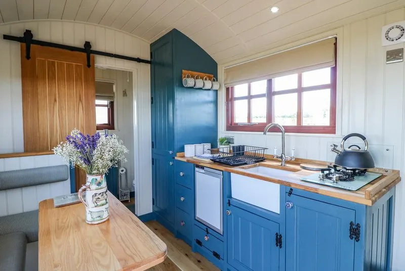 Sweet Caroline Shepherd's Hut blue kitchenette and dining nook