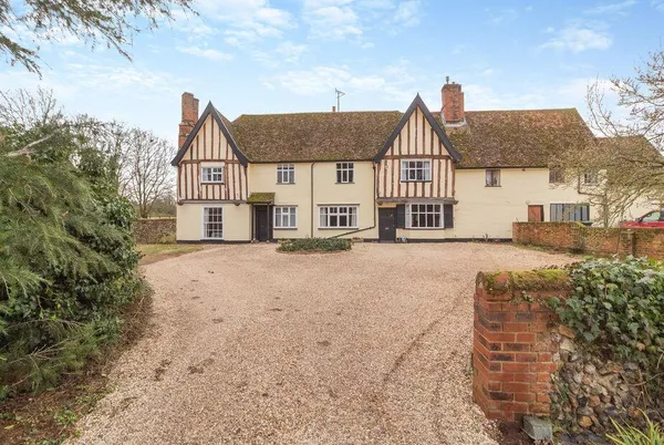 Sycamore Farmhouse half-timbered Tudor exterior with blue sky