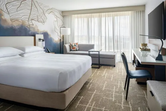 Hotel room with a large bed and a desk