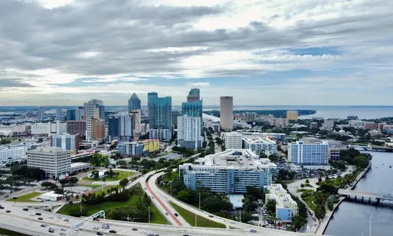 Aerial view of downtown Tampa and the waterfront under cloudy skies