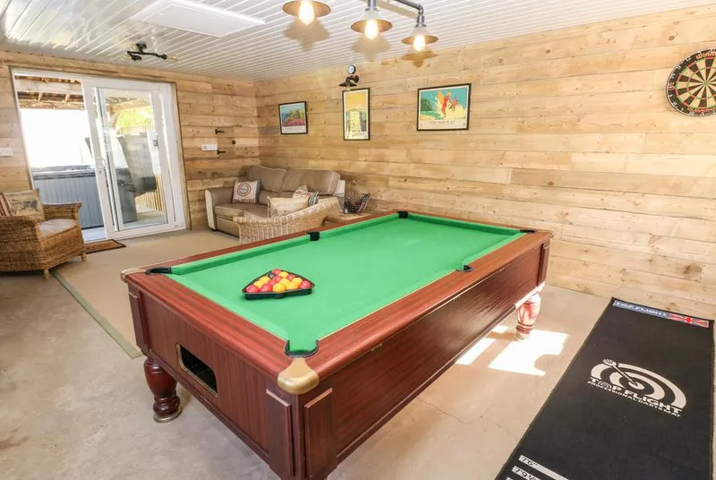 The Elms wood-panelled games room with a full-size pool table
