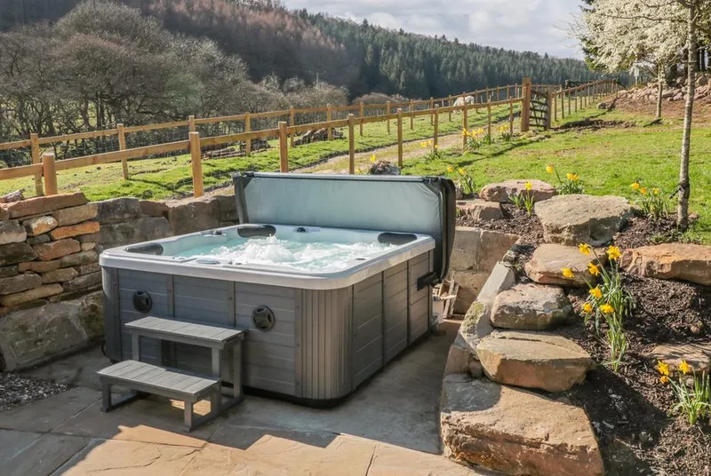 Thompson Rigg Barn hot tub with moorland valley backdrop