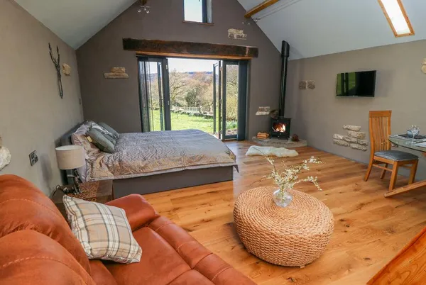 Thompson Rigg Barn open-plan living with wood burner and vaulted ceiling