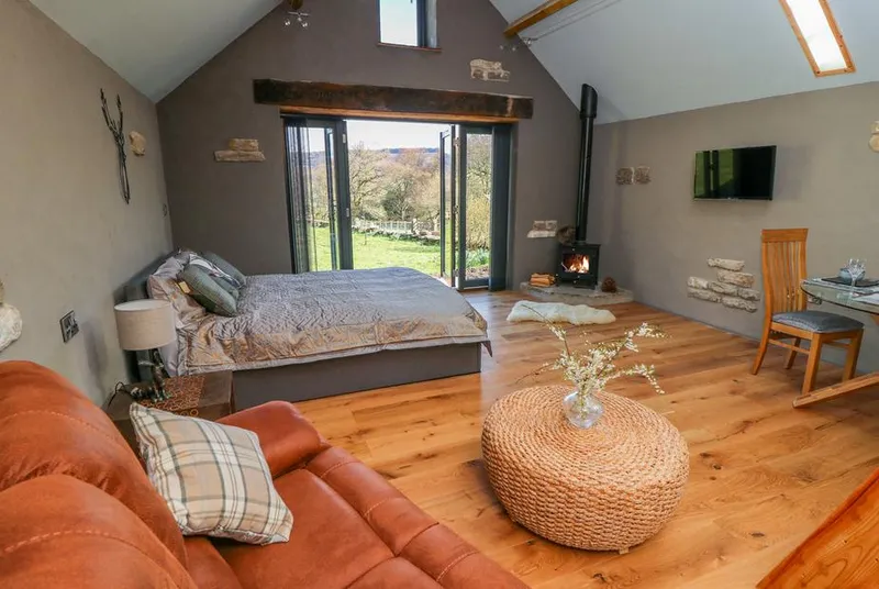 Thompson Rigg Barn open-plan living with wood burner and vaulted ceiling