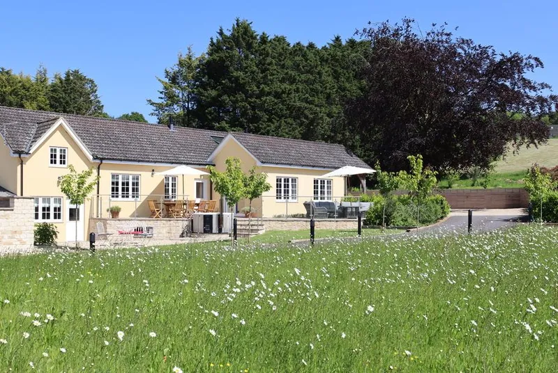 The Anchorage from wildflower meadow with rolling Wiltshire hills