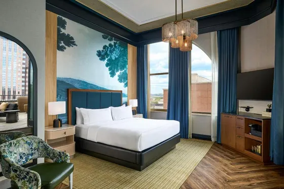Bedroom with a bed and a large window