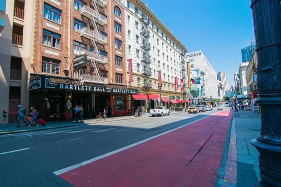 City street with buildings and people walking on the street