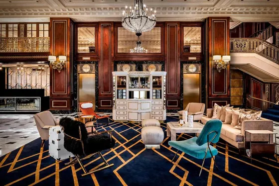 Large living room with furniture and a chandelier