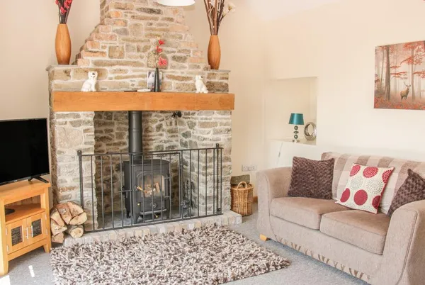 The Boundary Annex sofa by the stone fireplace