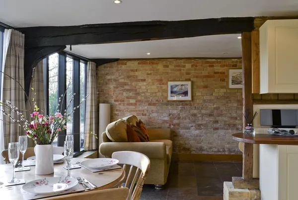 The Cart Lodge-E3568 dining and lounge with exposed brick
