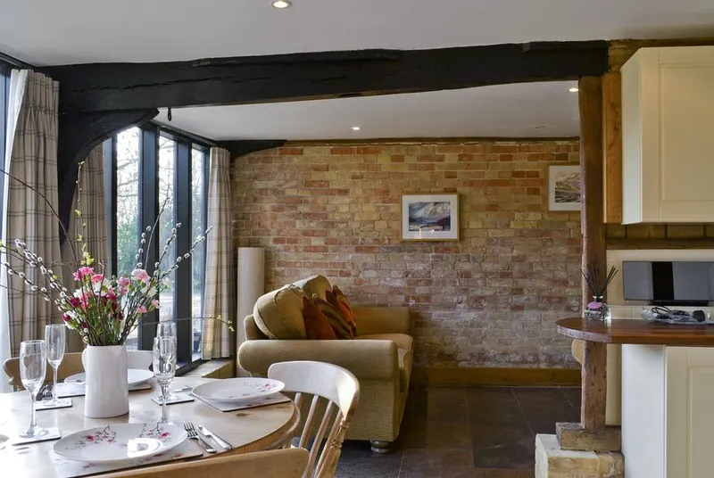 The Cart Lodge-E3568 dining and lounge with exposed brick