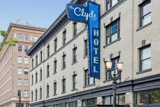 Blue hotel sign in front of a building