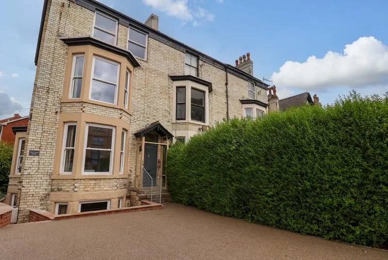The Corner House four-storey Victorian brick house with bay windows