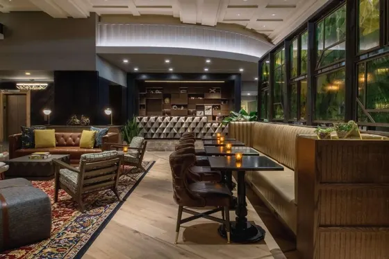 Lobby of a hotel with tables and chairs