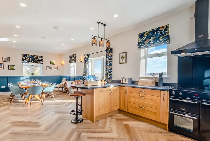 The Farm House open-plan kitchen diner with long table and island