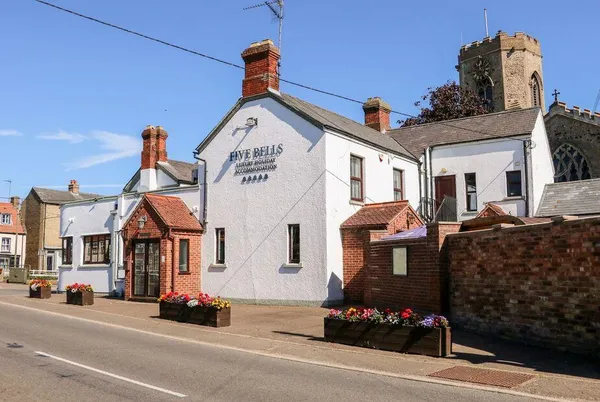 The Five Bells Inn closer view with flower boxes and pub signage