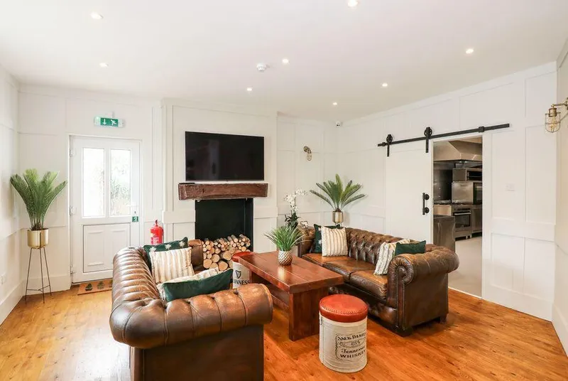 The Five Bells Inn Chesterfield lounge with log-filled fireplace